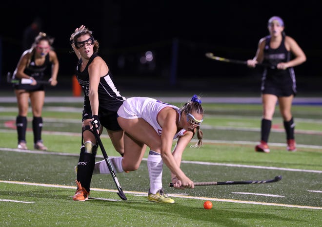 Christian Academy of Louisville player Elise Bearance (13) battled against Assumption player Bentlea Schwartz (12) during the KHSAA Field Hockey Championship on the CAL field in Louisville, Ky. on Oct. 28, 2019.  