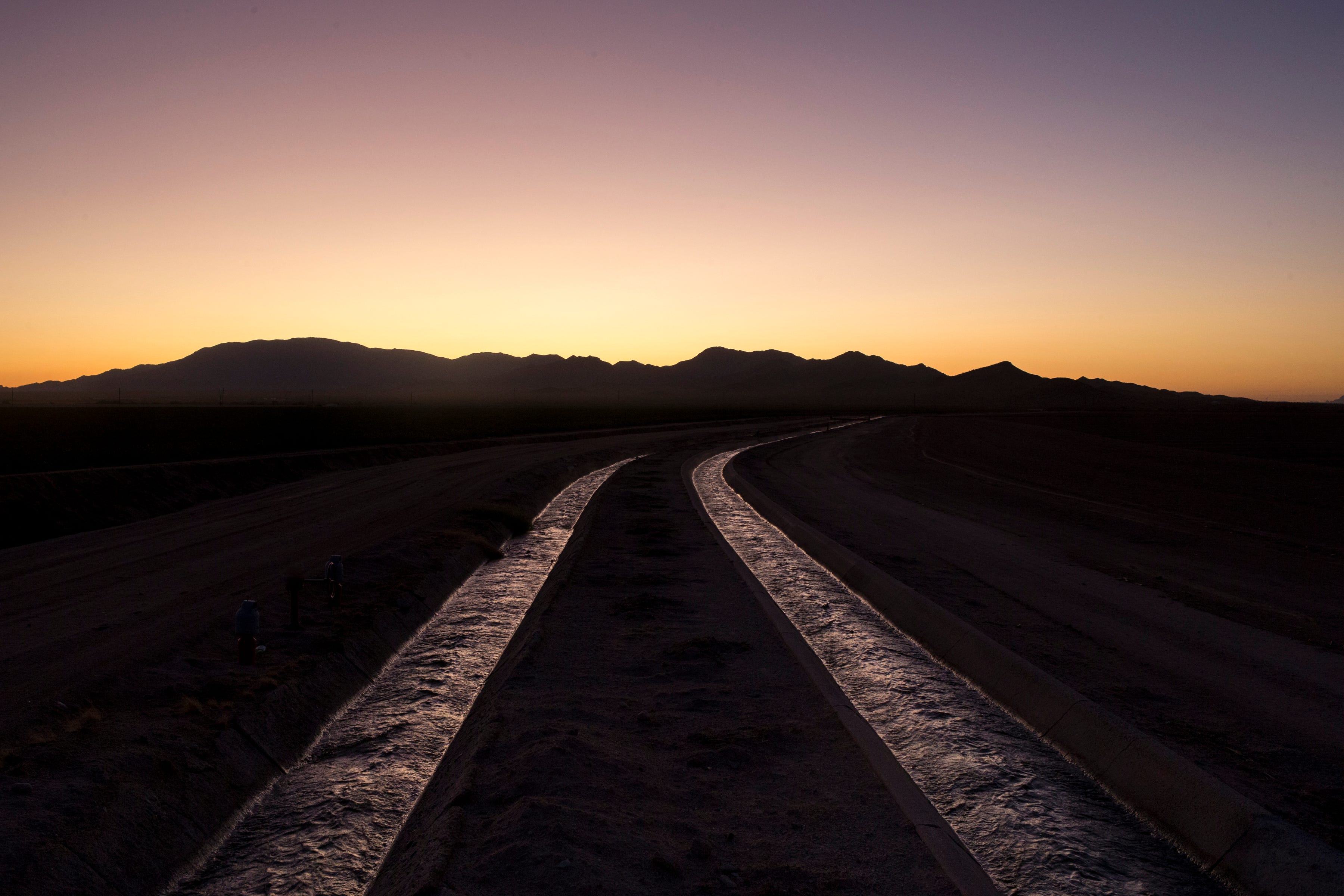 Water pumped from wells flows through canals at a farm in Salome operated by LKH Farming.