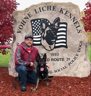 Stevens Point Police Officer J.D. Ballew and his new partner, Alana, pose after meeting at the Vohne Liche Kennels in Denver, Indiana.