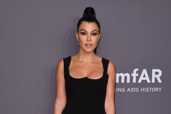 Kourtney Kardashian clapped back at a critic on Instagram who told her to cut her son's hair.