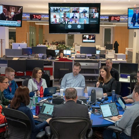 Editorial leaders gather to discuss the days news 