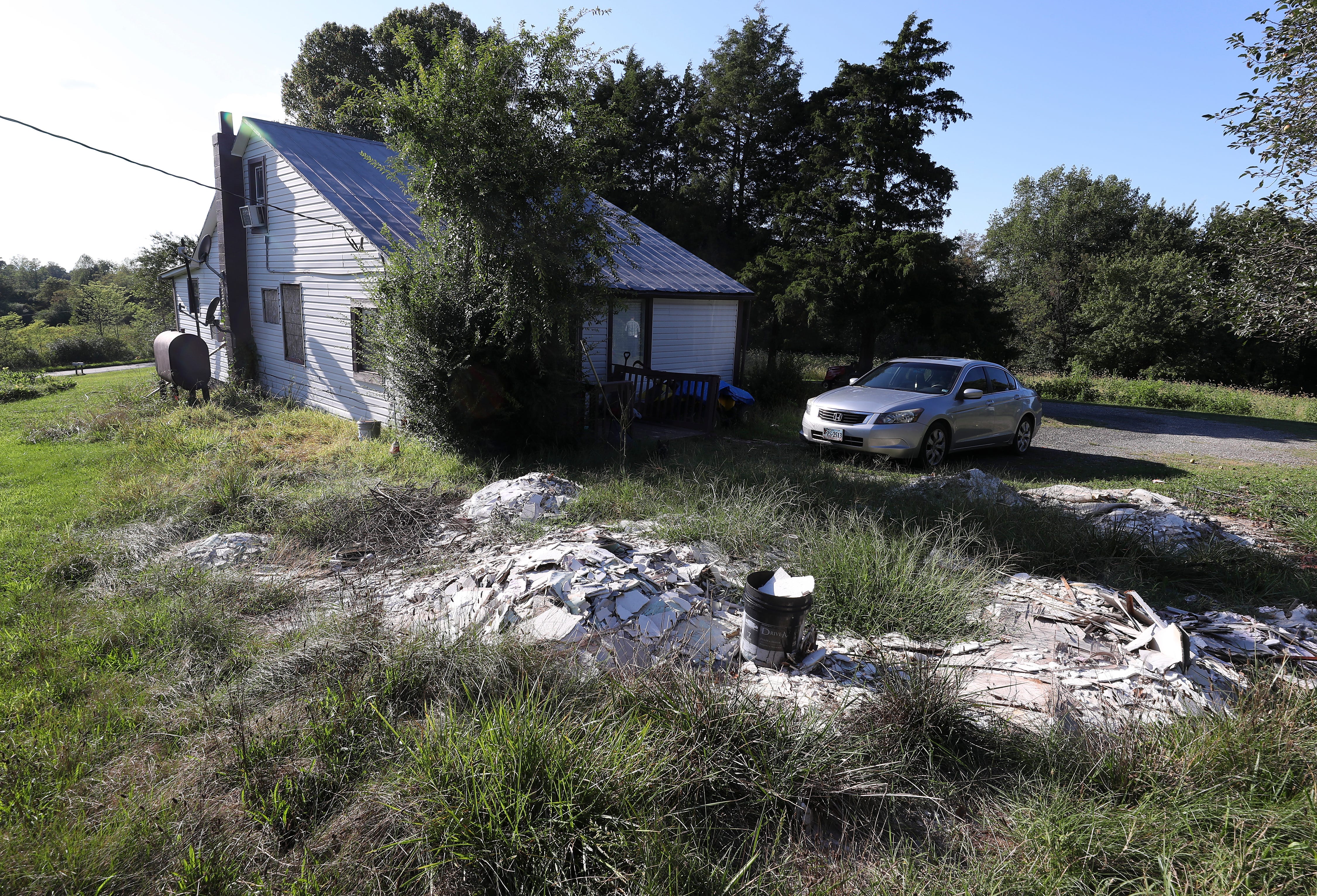 Part of a property in Axton, Virginia, that was identified in court papers as being related to an investigation of a cartel drug case. The remnants of damaged drywall is piled up in the backyard after new residents moved in.