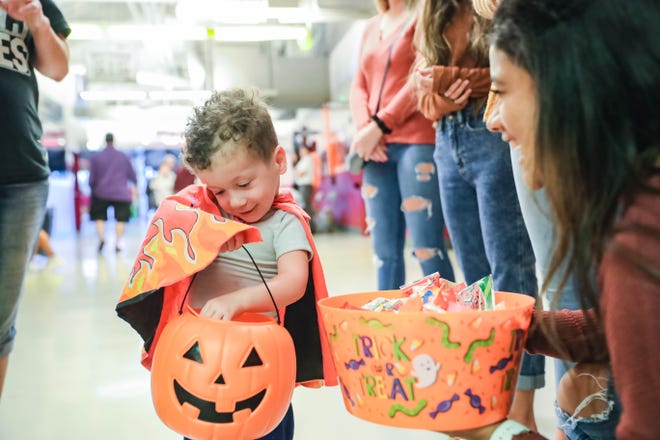 Children trick or treat at a Halloween Hoops  event at the Pan American Center in Las Cruces on Tuesday, Oct. 29, 2019.