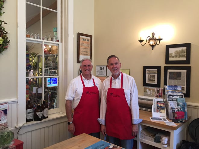 Noble owners Sheldon Nueman and Gene Galley pose for a photo. The business closed in downtown Lexington on Oct. 28, 2019.