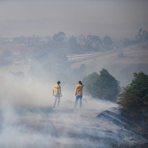 Los Angeles County Firefighters work to contain th