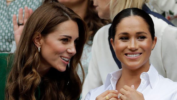 Kate, Duchess of Cambridge, left, and Meghan, Duch