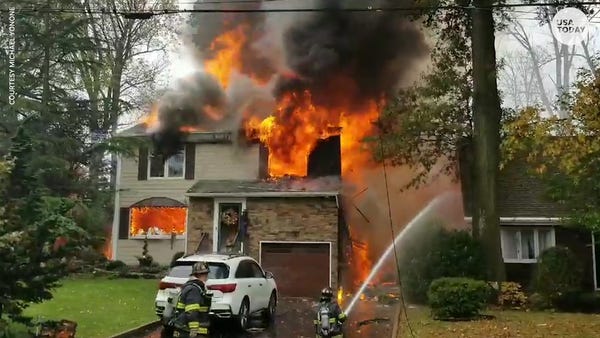 Small plane crashes into a house in New Jersey, bu