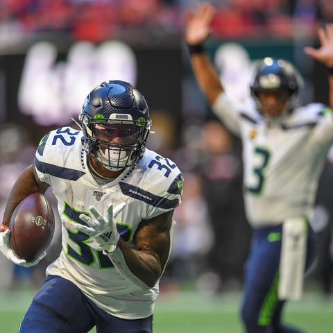 Seahawks running back Chris Carson heads toward th