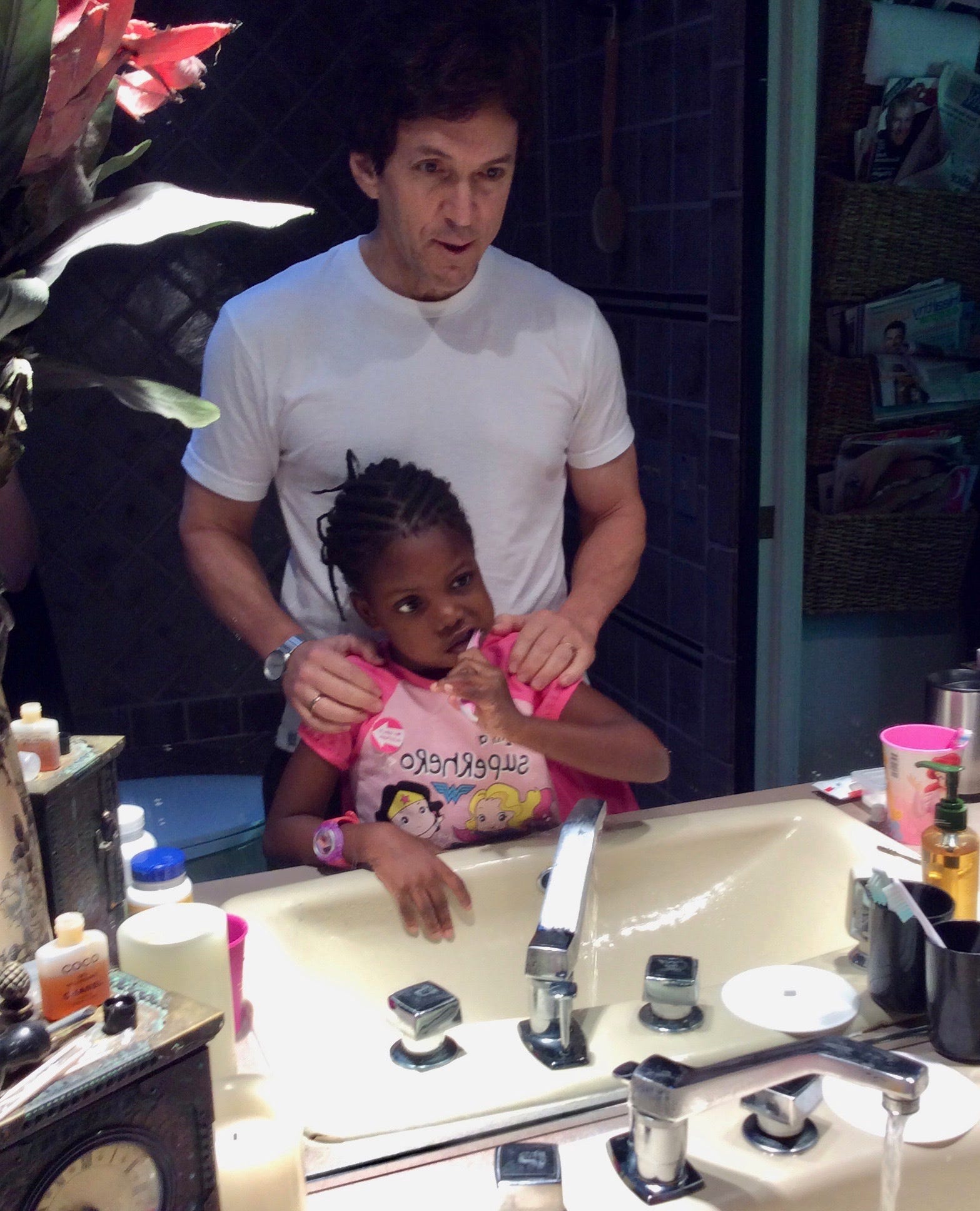 Chika, 5, and Mitch Albom during their daily morning and evening teeth brushing routine at the Alboms' home in July 2015.