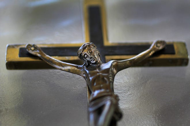 Father Mike Maginot used this crucifix, seen on on Sept. 13, 2013, to see if demons were present in Latoya Ammons. When he placed the crucifix on her, she convulsed, showing their presence.
