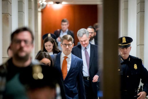 hristopher Anderson, center left, a State Department Foreign Service officer, arrives for a closed door meeting to testify as part of the House impeachment inquiry into President Donald Trump on Capitol Hill in Washington, Oct. 30, 2019.&nbsp;