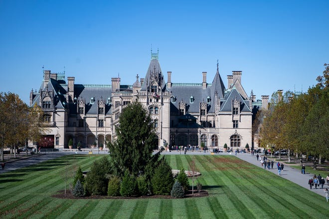 The Biltmore Estate has reduced capacity for visits into Biltmore House, meaning fewer reservation times are available each day. In this file photo, visitors tour the grounds outside of the Biltmore House during the annual Biltmore tree-raising on the estate in November 2019.
