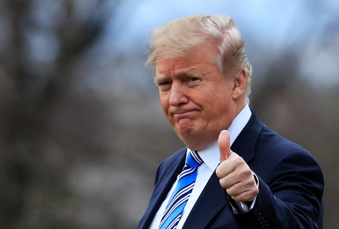 President Donald Trump gestures to the media as he leaves the White House in this 2018 photo.