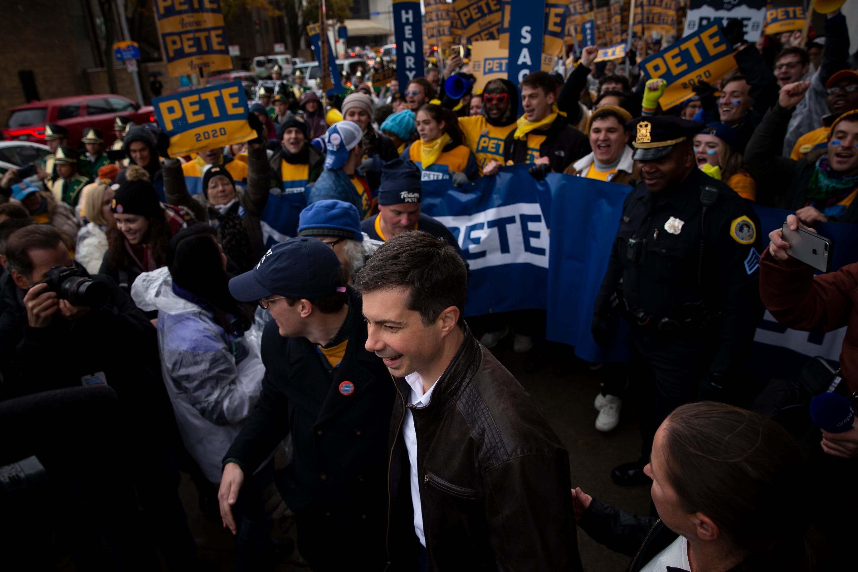South Bend Indiana Mayor and 2020 Democratic presidential candidate Pete Buttigieg marches with supporters before the Iowa Democratic Party's 2019 Liberty and Justice Dinner on Friday, Nov. 1, 2019 in Des Moines.