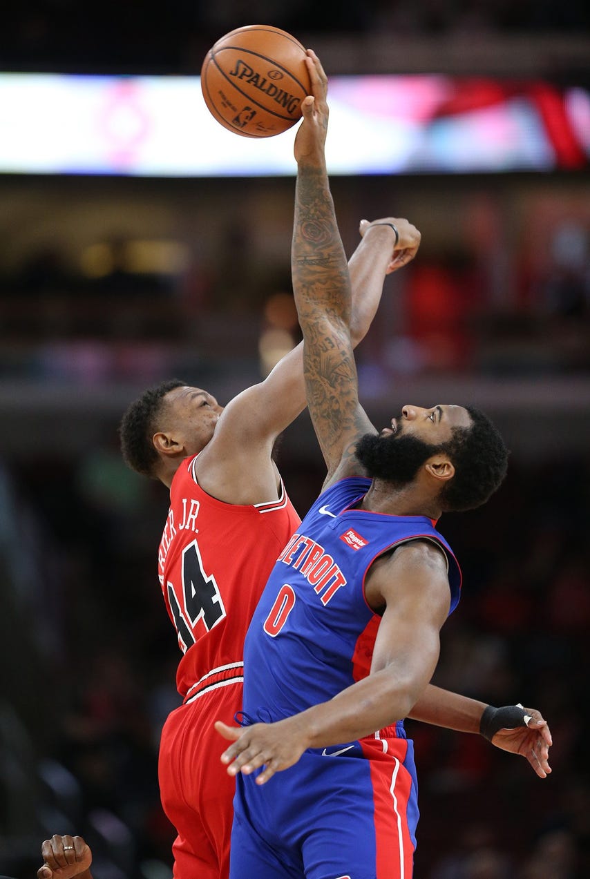 The Detroit Pistons' Andre Drummond (0) reaches the tipoff before Chicago Bulls' Wendell Carter Jr. (34) at the United Center in Chicago on Friday, Nov. 1, 2019.