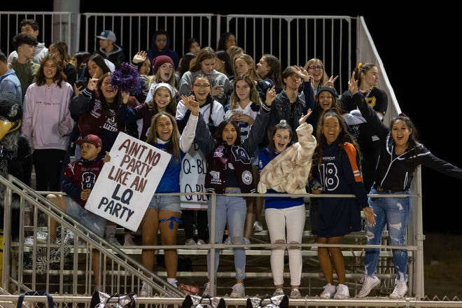 The La Quinta student section cheers on the Blackhawks against Xavier Prep in high school football Nov. 1, 2019.