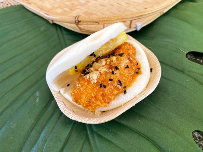 Hot chicken bun with banana and scorpion pepper hot sauce and pickled pineapple from Clever Koi at the 2019 azcentral Wine & Food Experience at Salt River Fields near Scottsdale.