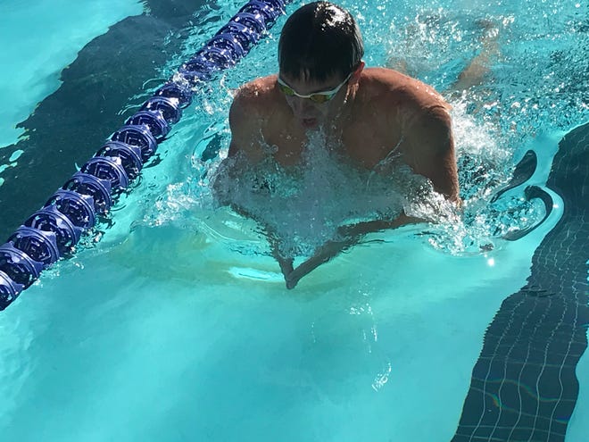 Simpson swimmer Tom Higdon practices the breaststroke at the Redding YMCA in November 2019.