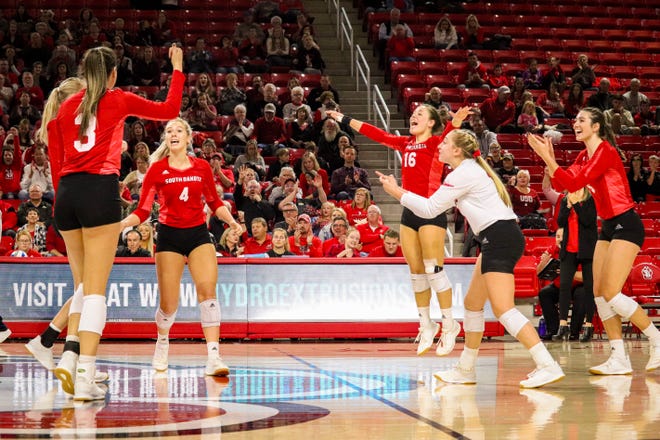 South Dakota volleyball team celebrates a point against Denver on Nov. 3, 2019 at the Sanford Coyote Sports Center in Vermillion, S.D.