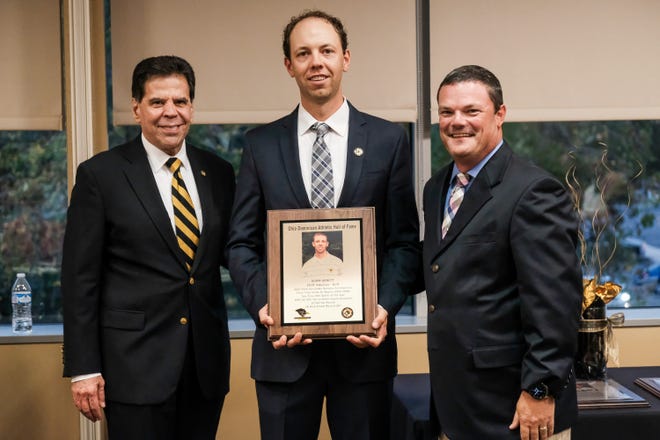 Former Fisher Catholic golf standout, Adam Arnett, was inducted into the Ohio Dominican University Black and Gold Athletic Hall of Fame. Arnett is pictured with the President of Ohio Dominican University , Dr. Robert A Gervasi and Ohio Dominican University golf coach Chris Deibel.