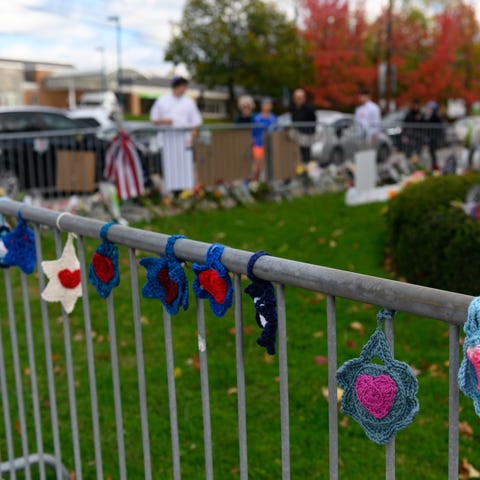Woven Stars of David are shown along the fence at 