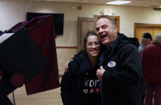 Mike Faccone of Freehold Boro shows off his "I Voted" sticker after casting his vote with his wife, Karie Faccone, on Election Day at the Freehold Elks in Freehold, NJ Tuesday, November 5, 2019. 