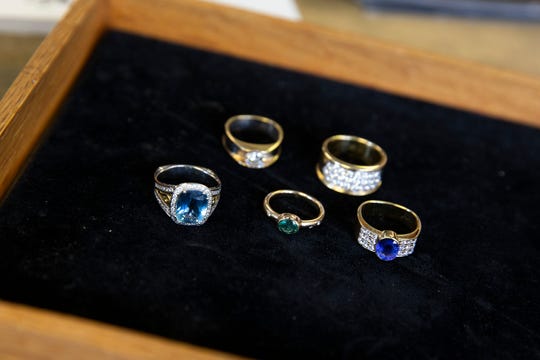 Joel McFadden, owner of The Art of Jewelry, a Red Bank-based business that designs and sells jewelry for its clients, displays some of his work at his business in Red Bank, NJ Tuesday, November 5, 2019. 