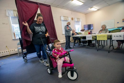 Maria Marino of Toms River votes with her 17-month-old daughter, Isabella, on Election Day at the First United Methodist Church in Toms River, NJ Tuesday, November 5, 2019. 