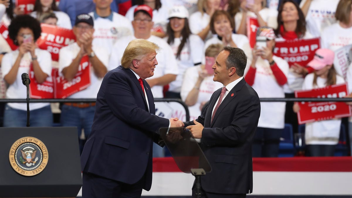 President Donald Trump, left, brought Gov. Matt Bevin up to the stage after he made remarks supporting Bevin's re-election at Rupp Arena in Lexington, Ky. on Nov. 4, 2019.