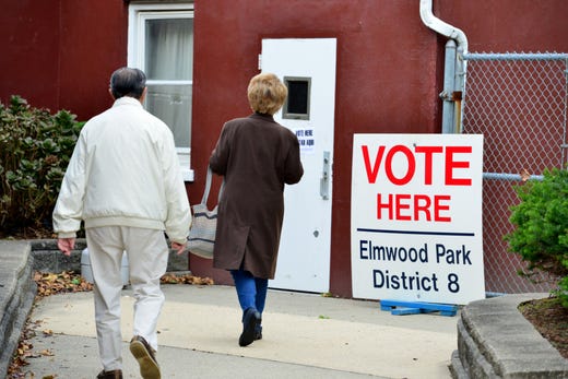 A voters walk into the polling area at the fire house on Mola Blvd in Elmwood Park, N.J. on Tuesday Nov. 5, 2019.