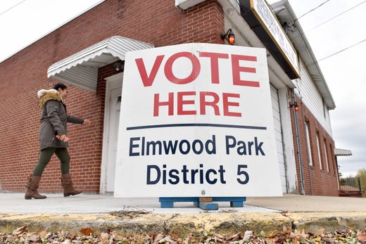 Nejesea Brown, of Elmwood Park, walks into her polling station in Elmwood Park, N.J. on Tuesday Nov. 5, 2019.