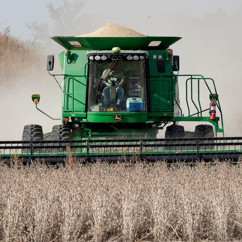 A combine harvests soybeans in rural Blair, Nebras