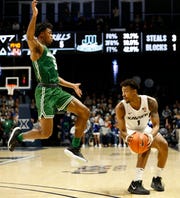 Jacksonville Dolphins guard DeAnthony McCallum (5) defends Xavier Musketeers guard Paul Scruggs (1) in the second half of NCAA basketball game between the Xavier Musketeers and the Jacksonville Dolphins at the Cintas Center in Cincinnati on Tuesday, Nov. 5, 2019. Xavier won its season-opening game, 76.57.