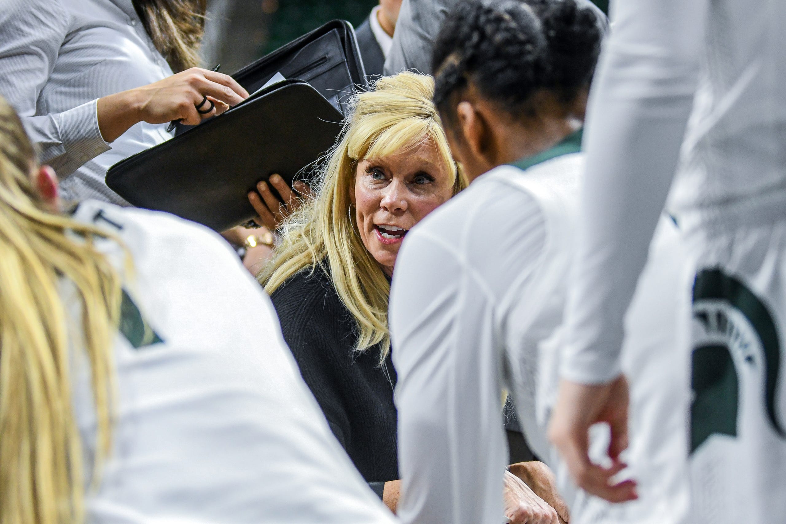 Michigan State's head coach Suzy Merchant talks with players during the second quarter on Tuesday, Nov. 5, 2019, at the Breslin Center in East Lansing.