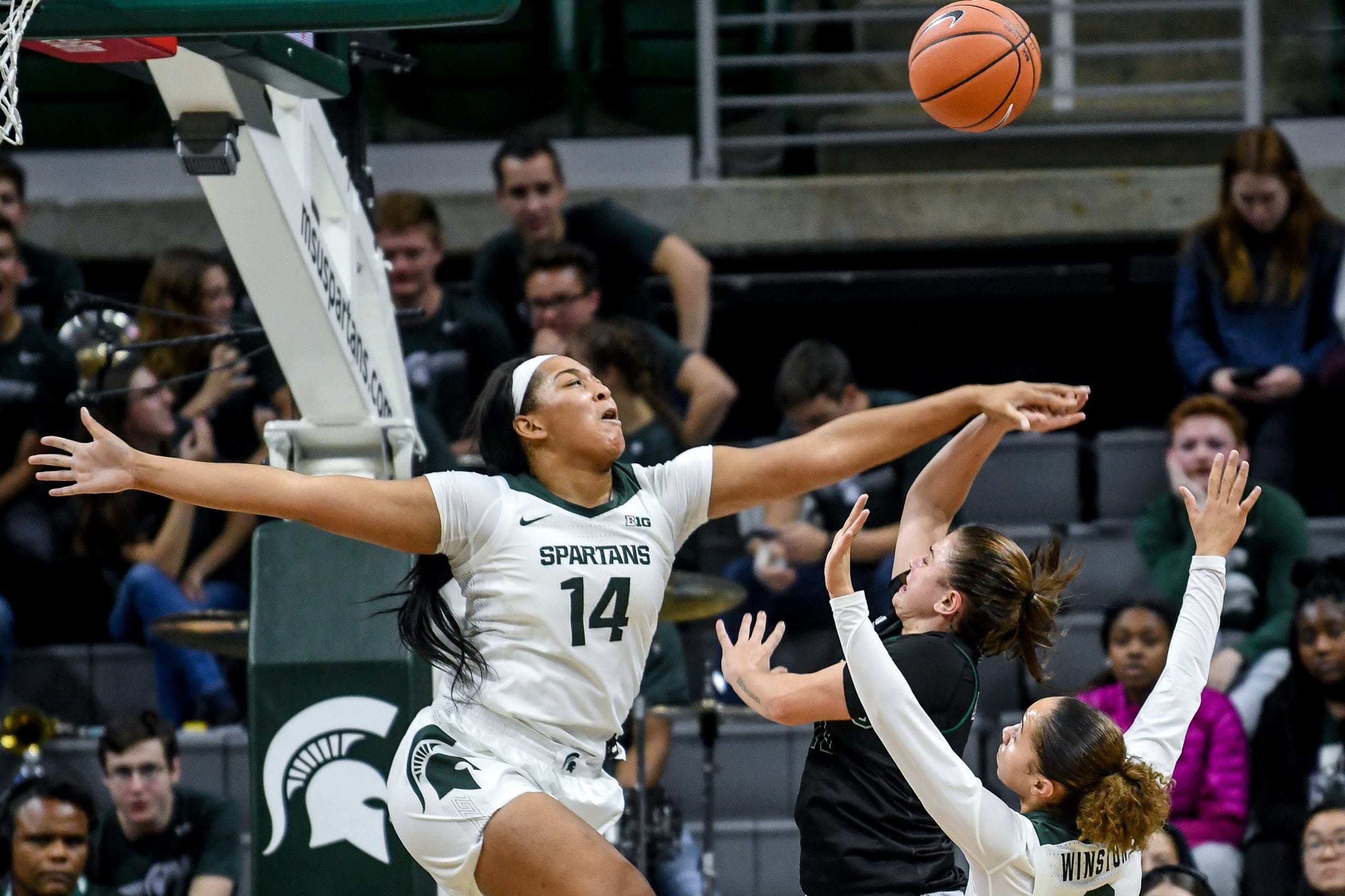 Michigan State's Taiyier Parks, left, blocks a shot Eastern Michigan's Jenna Annecchiarico during the third quarter on Tuesday, Nov. 5, 2019, at the Breslin Center in East Lansing.