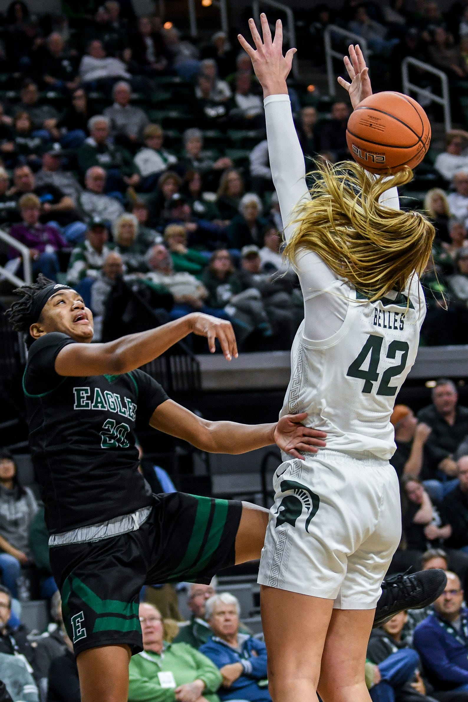 Michigan State's Kayla Belles, right, tips a pass made by Eastern Michigan's Corrione Cardwell during the  second quarter on Tuesday, Nov. 5, 2019, at the Breslin Center in East Lansing.