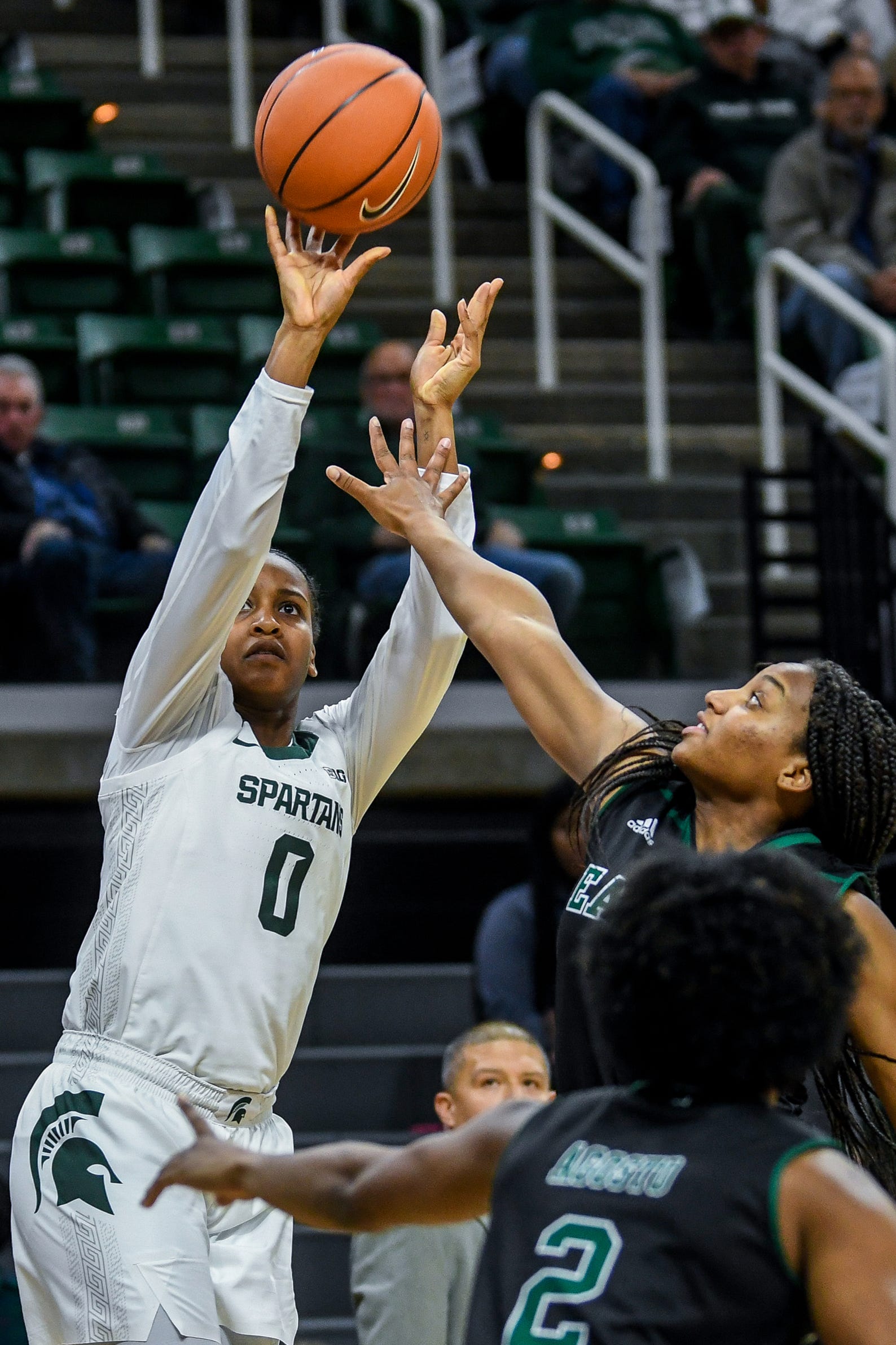 Michigan State's Shay Colley, left, shoots as Eastern Michigan's Courtnie Lewis defends during the first quarter on Tuesday, Nov. 5, 2019, at the Breslin Center in East Lansing.