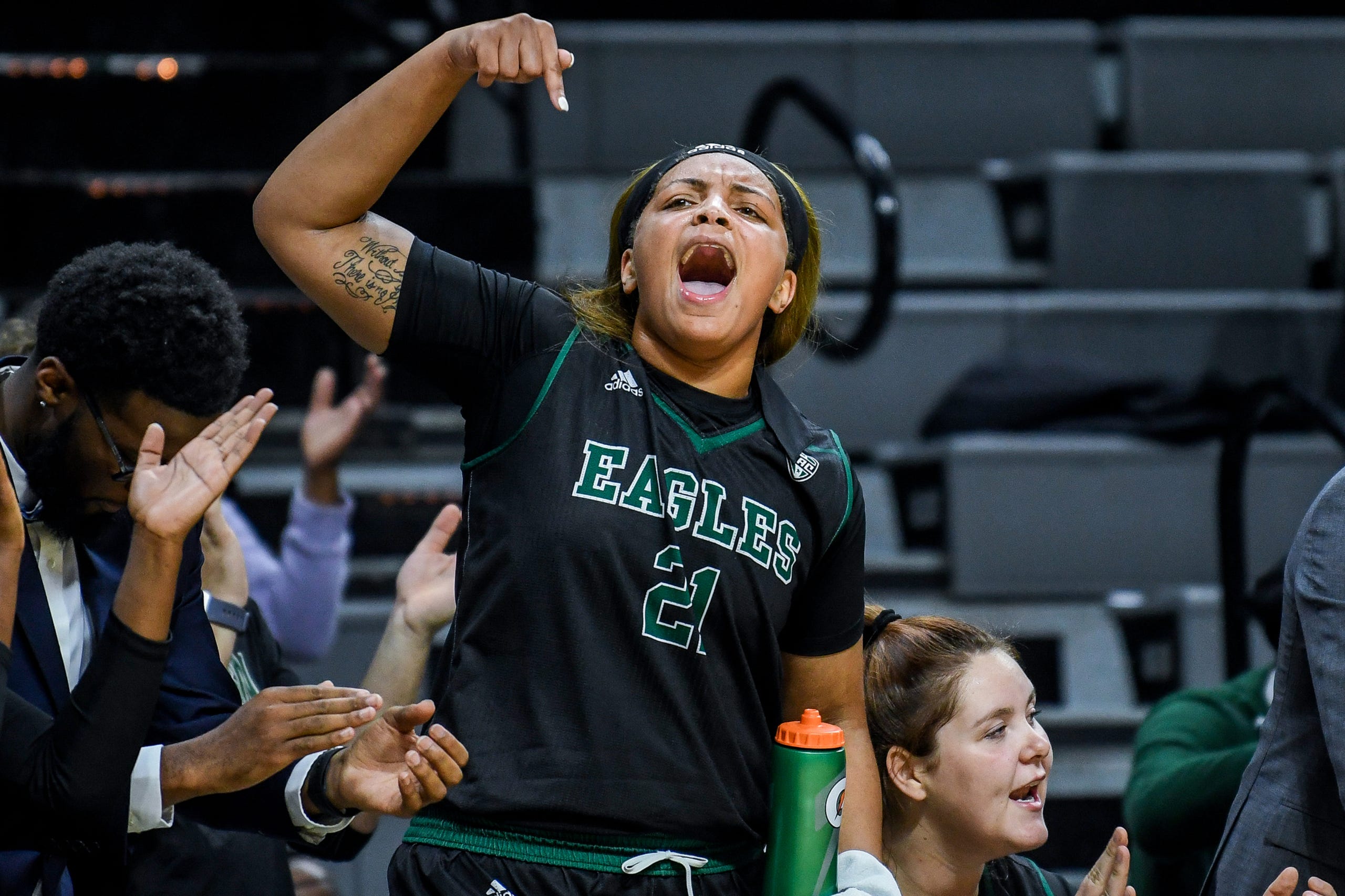 Eastern Michigan's Kiara Johnson celebrates on the bench during the second quarter on Tuesday, Nov. 5, 2019, at the Breslin Center in East Lansing.