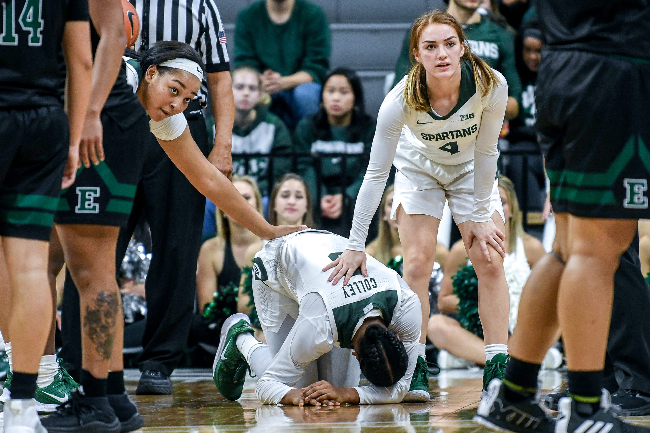 Michigan State's Taiyier Parks, left, and Taryn McCutcheon, right, comfort teammate Shay Colley, center, after Colley was injured during the fourth quarter on Tuesday, Nov. 5, 2019, at the Breslin Center in East Lansing.