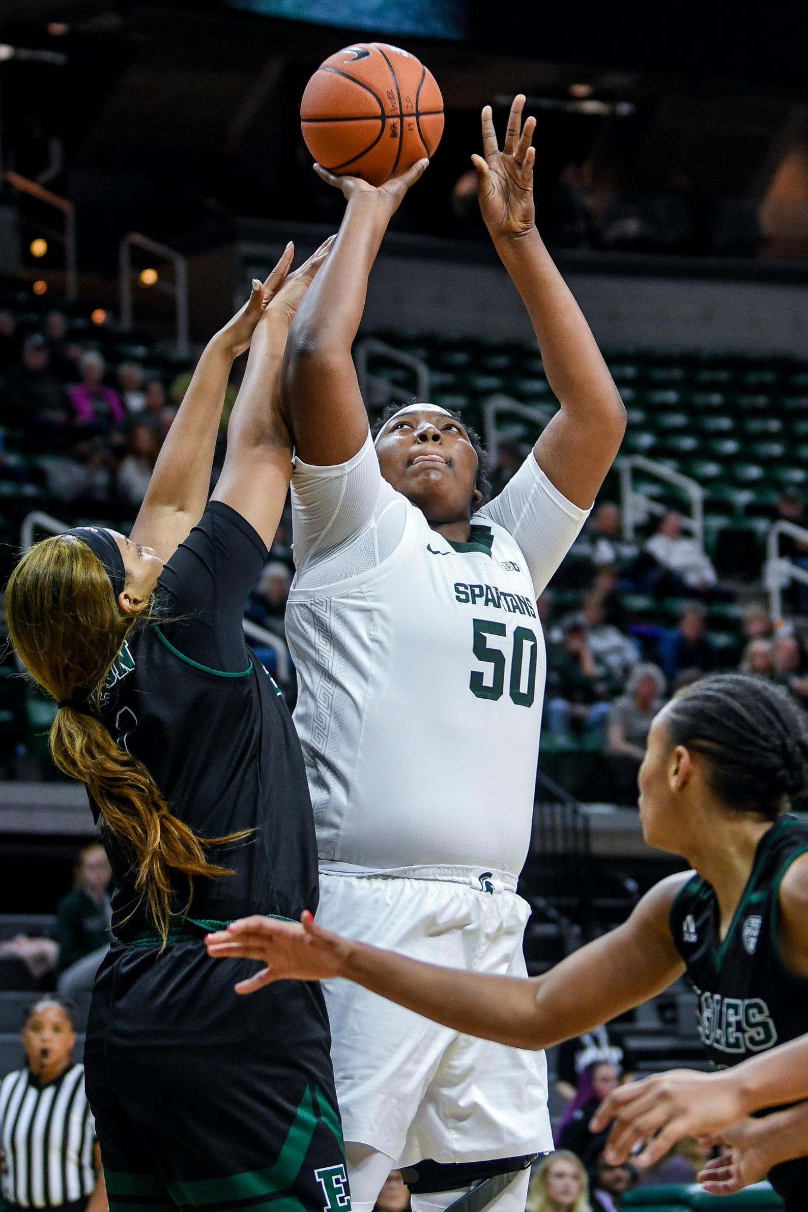 Michigan State's Cydni Dodd, right, shoots as Eastern Michigan's Kiara Johnson defends during the  fourth quarter on Tuesday, Nov. 5, 2019, at the Breslin Center in East Lansing.