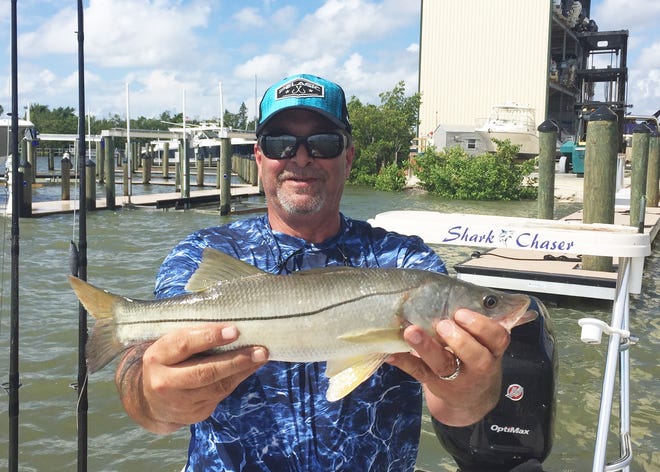 Rohman Bahar with a catch and release snook caught off Goodland.