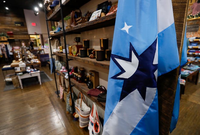 The proposed new Springfield flag hangs inside of Five Pound Apparel on South Avenue in downtown Springfield.