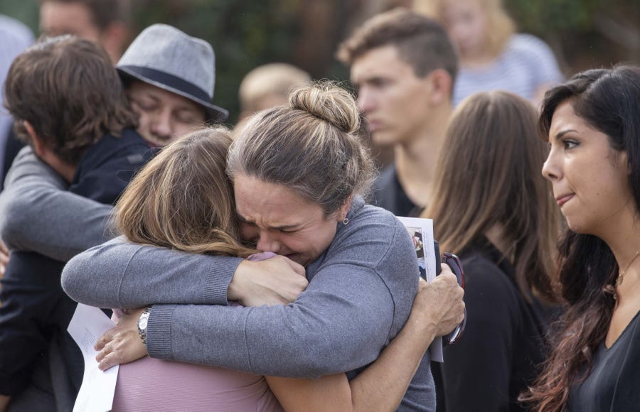 Family members and friends console each other while they attend the funeral for Dawna Ray Langford and her two children Trevor, 11, and Rogan, 2, on Nov. 7, 2019. They were ambushed by gunmen in Sonora, Mexico.