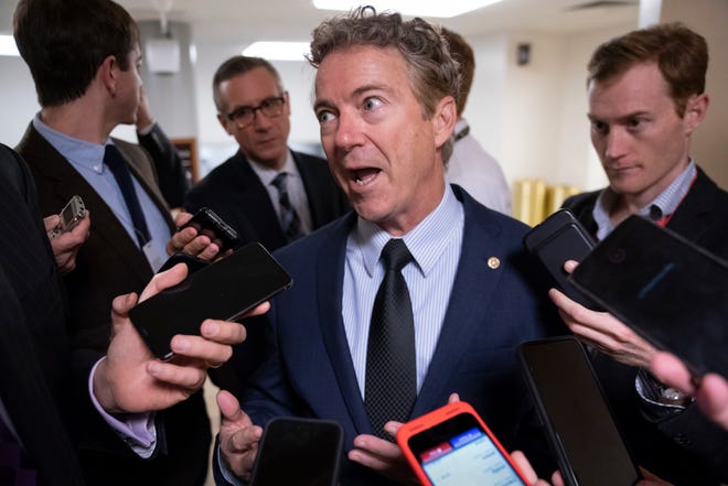 Sen. Rand Paul, R-Ky., responds to reporters at the Capitol after he threatened to reveal the name of the Ukraine whistleblower who helped initiate the impeachment inquiry against President Donald Trump by providing details of Trump's call with the Ukrainian president, in Washington, Nov. 6, 2019.