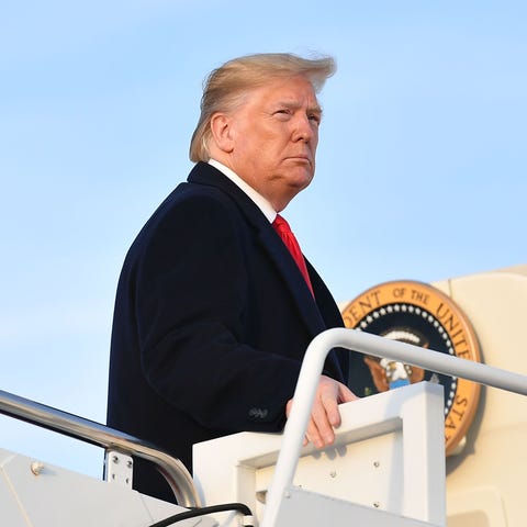 President Donald Trump boards Air Force One on Nov