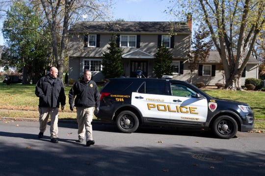 Police swarm the residence of John Ozbilgen, the former boyfriend of Stephanie Parze, in the week after Parze's disappearance.