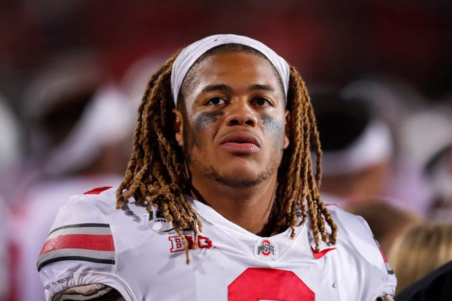 In this Oct. 18, 2019, file photo, Ohio State defensive end Chase Young looks at the scoreboard during the second half of an NCAA college football game against Northwestern, in Evanston, Ill. Ohio State says defensive end Chase Young won't play Saturday against Maryland due to possible NCAA violation in 2018.