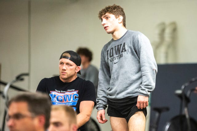 Iowa's Austin DeSanto and assistant coach Ryan Morningstar watch matches during the first day of preseason Hawkeye wrestling matches, Thursday, Nov., 7, 2019, inside the Dan Gable Wrestling Complex at Carver-Hawkeye Arena in Iowa City, Iowa.