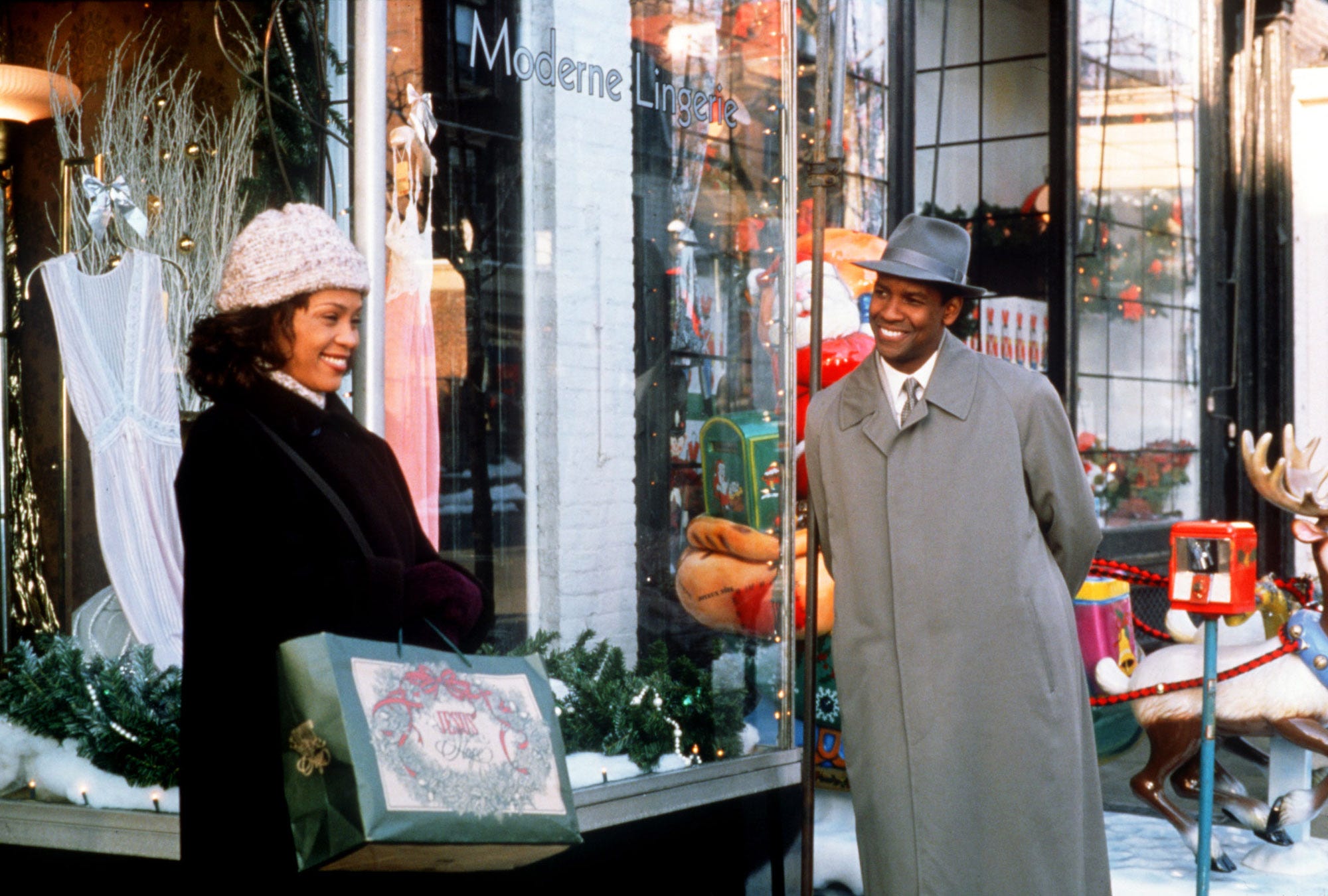 Denzel Washington, right, is an angel come to Earth who charms Whitney Houston during the Christmas season in "The Preacher's Wife."