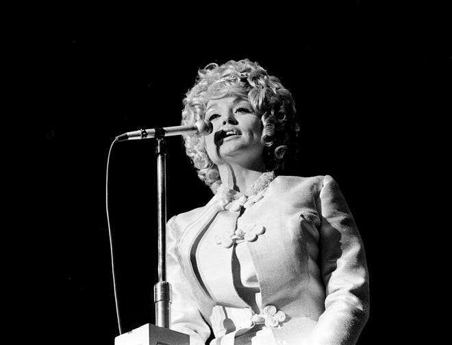 Dolly Parton performs at the Opry Spectacular Launchon, the first official event of the 44th anniversary of the Grand Ole Opry, held at the Municipal Auditorium on October 16, 1969.